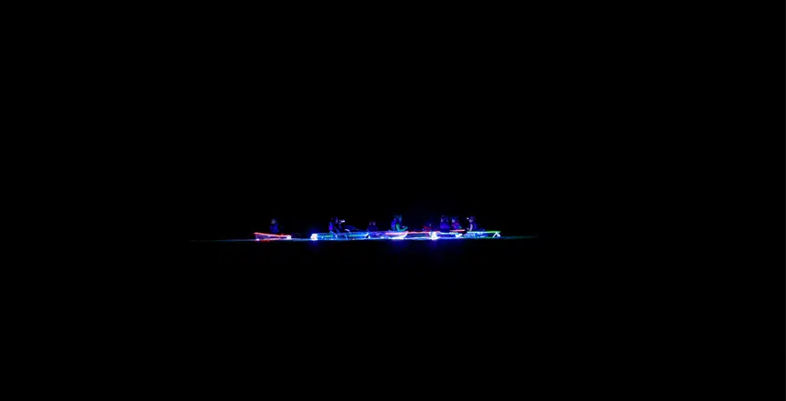 Clear kayaks with lights at night on Lake Macquarie